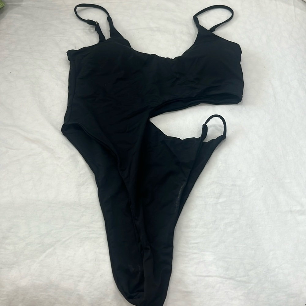 Black one piece bathing suit with cut outs